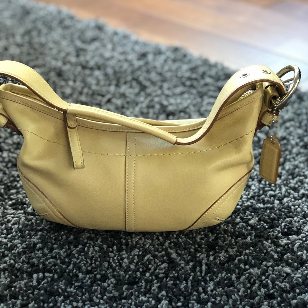 Beige coach bag. Small.